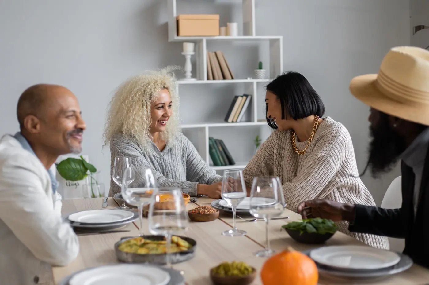 Guests talking over lunch at a shared table