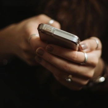 A woman using her phone.