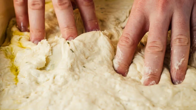Kneading dough using hands