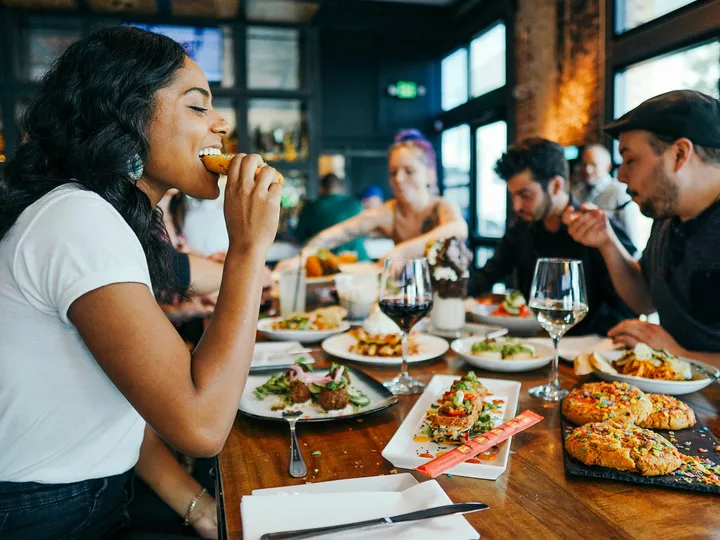 A group of people eating together